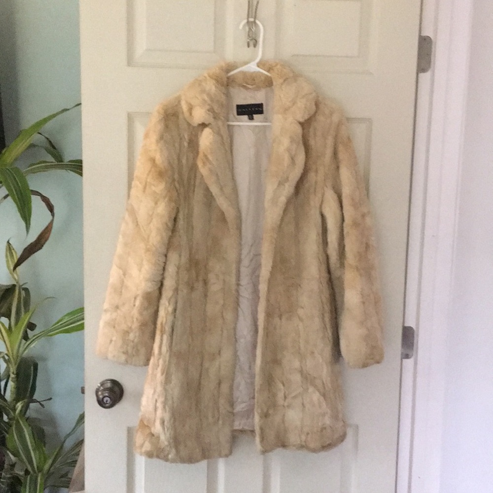 Blonde faux fur coat.